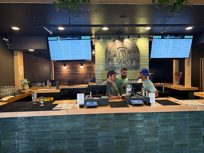 Image of same open bar area in previous photo, but renovated for new business.